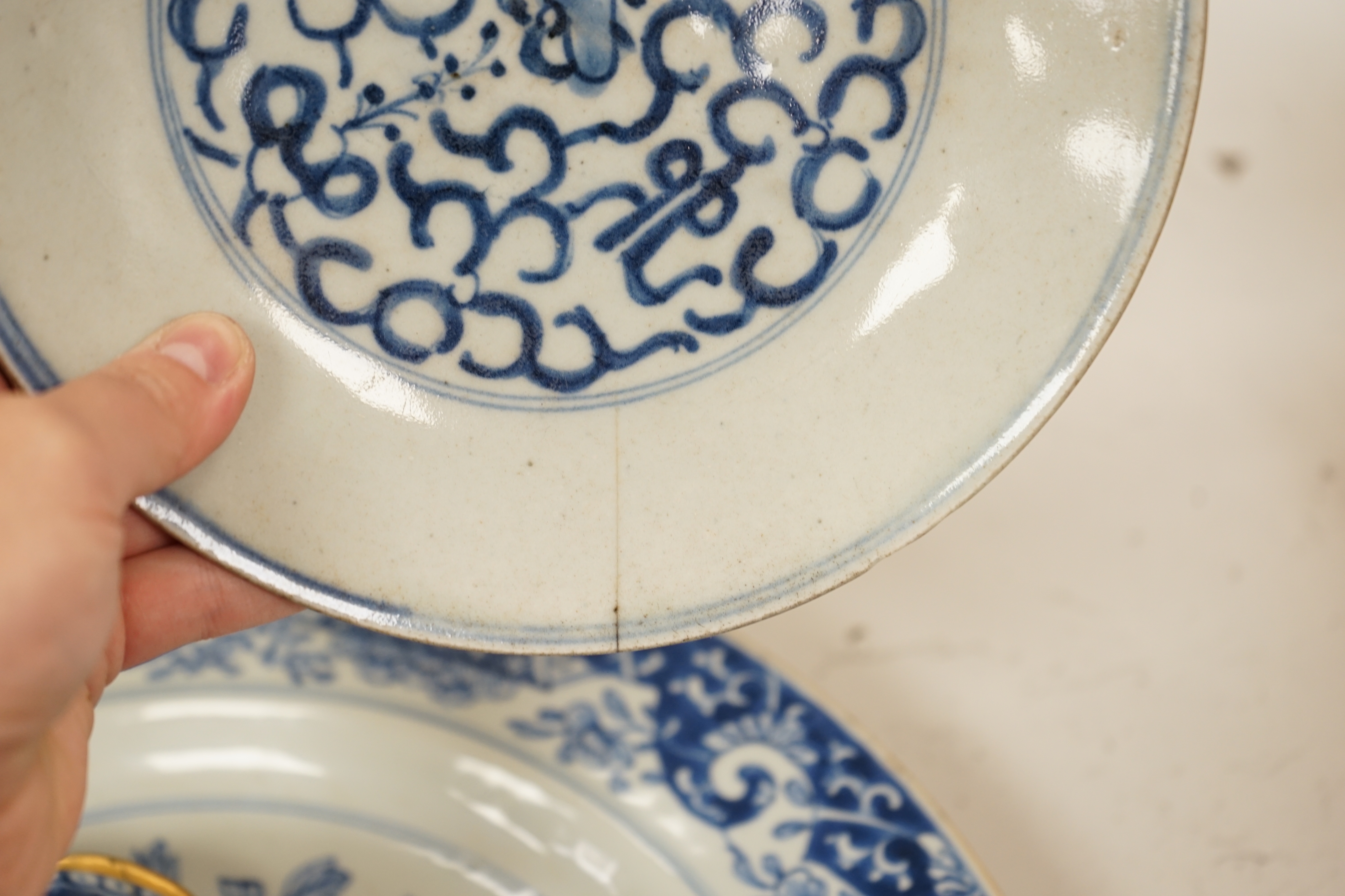 A Worcester teapot, c.1770, two 18th century Chinese porcelain dishes, a cup and saucer, a Chinese shallow bowl and a small teapot, largest dish 39cm